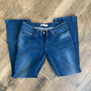 Levi’s dark blue jeans.